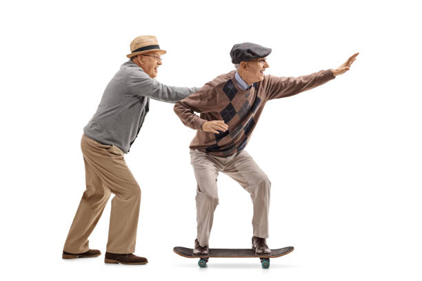 istock Senior pushing another senior on a skateboard 896165364