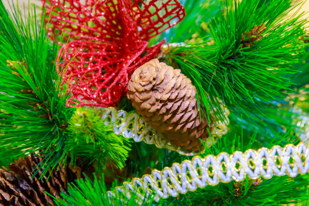 istock Natural cone decorates an artificial Christmas tree close 896170814