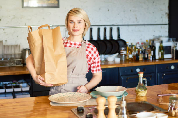 istock Cheerful Housewife in Kitchen 896171814
