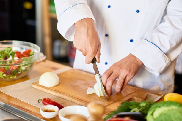 istock Chef Cutting Onions for Salad 896171834