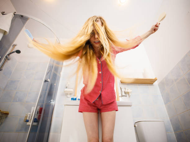 istock Woman brushing her long hair 896180184