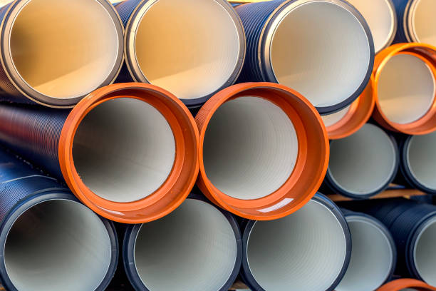 istock Pile of corrugated PVC sewer or drain pipes background 2 896180632