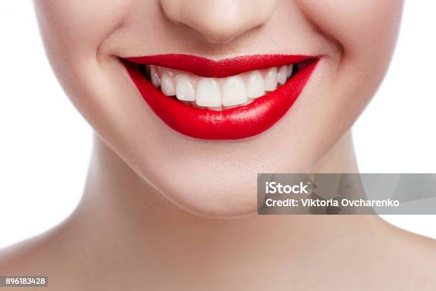 Healthy White Smile Close Up Beauty Woman With Perfect Smile Lips And White Teeth Beautiful Model Girl With Red Lips Isolated On White Background Teeth Whitening And Cleaning Dental Care Stock Photo - Download Image Now