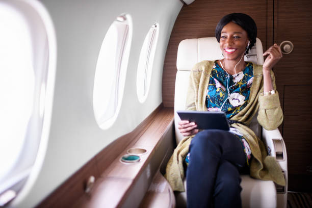 istock Woman in private jet airplane 896187954