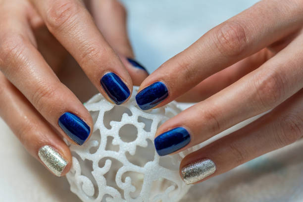 istock Beautiful female hands with blue manicure. 896190034