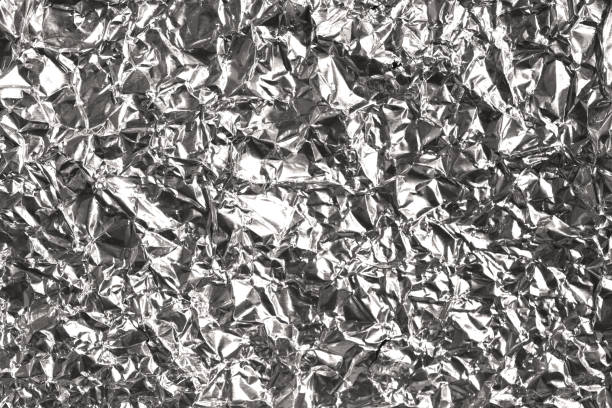 istock Silver wrinkled and shrunken foil surface, crinkly, crushed metallic background 896199156
