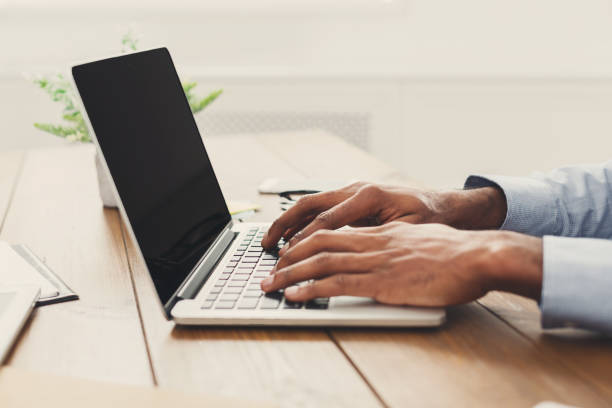 istock African-american businessman typing on laptop 896199734