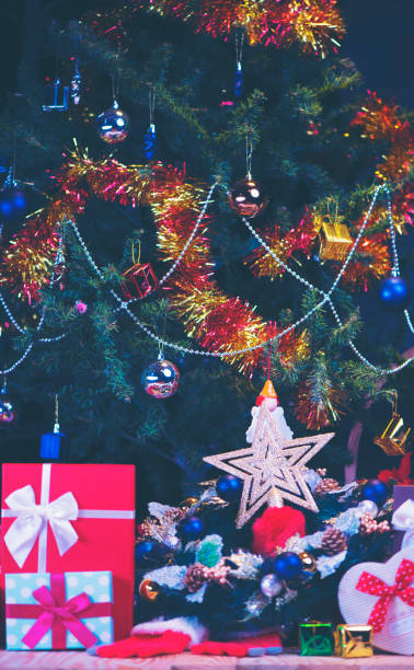 istock Christmas gift box. Christmas presents in red boxes at white wooden table. Flat lay with copy space. 896202352