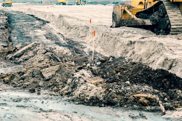 istock Working on road construction site with vehicles in background 3 896203278