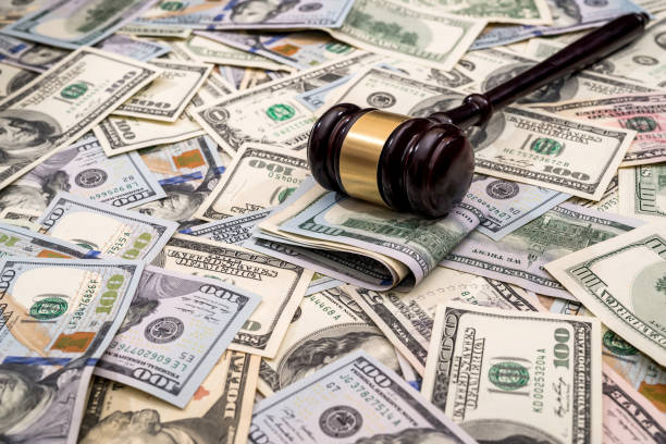 wooden hammer judge against the background of dollars wooden hammer judge against the background of dollars lawyer hammer stock pictures, royalty-free photos & images