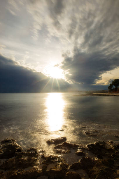 istock The calm sea in a very cloudy sunset 896208556
