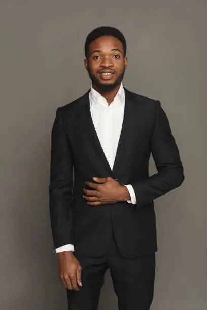 Photo of Handsome young black man portrait at studio background.