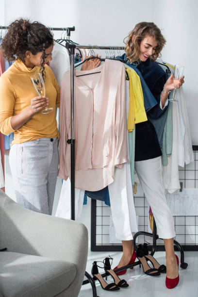istock fashion designers drinking champagne 896212056