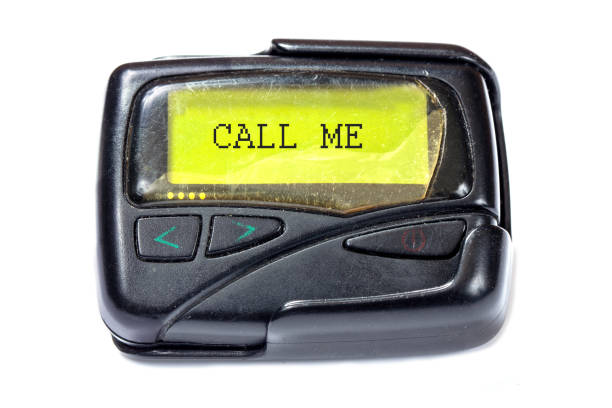 istock Old pager on a white background. Text call me on the screen 896212516