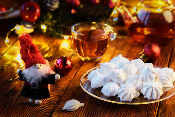 istock New Year's decor: meringue, cup of tea and Christmas decorations 896213150
