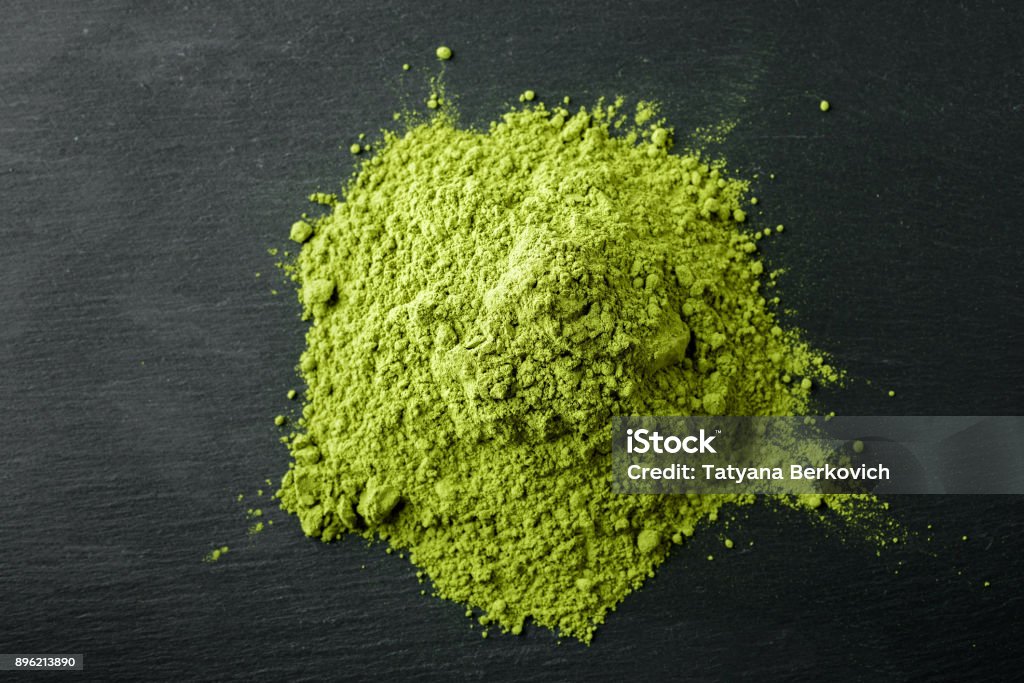 Matcha Tea- Japanese green tea on a black stone background Matcha Tea Stock Photo