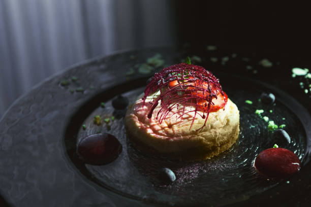istock Lemon cheesecake with berry spheres served at modern restaurant 896220850