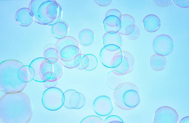 istock Soap bubbles floating in the air against soft clouds and sky. filtered image. selective focus. 896226540