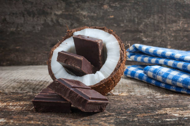 istock Coconut with chocolate on wooden background 896228556