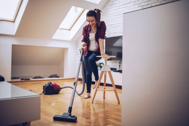 istock Girl enjoying in vacuuming 896229822
