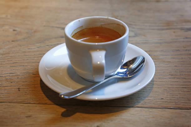 istock Close up white cup of espresso coffee on table 896234258
