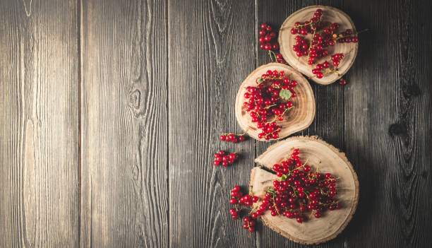 istock red currant berry on black wood boards 896234854
