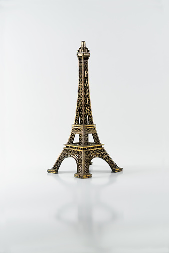 Miniature tower. On a white background. A small tower of Paris.
