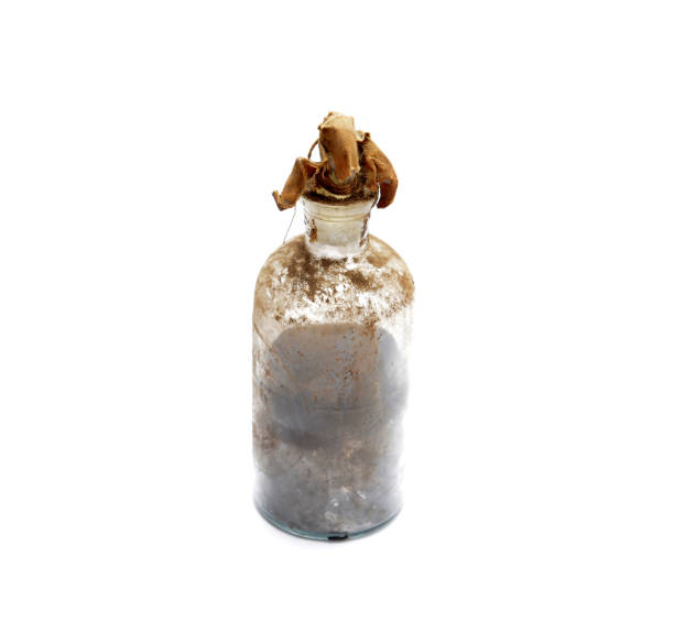 istock Old dirty and glass bottle with unknown liquid 896243418