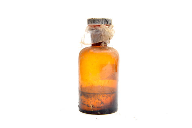 istock Old dirty and glass bottle with unknown liquid 896243606