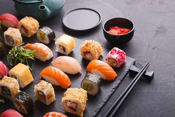 istock Sushi and rolls background, japanese cuisine 896250408