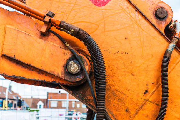 istock Orange mechanical arm of an excavator 896259228