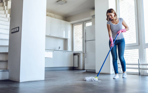 istock Young woman is doing cleaning at home 896260006