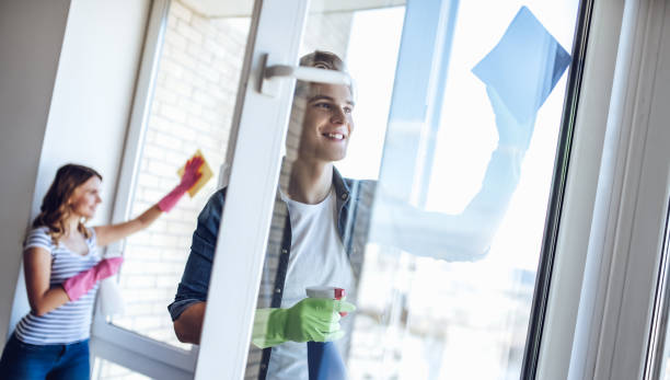 istock Couple is doing cleaning at home. 896260066
