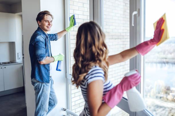 Couple is doing cleaning at home.