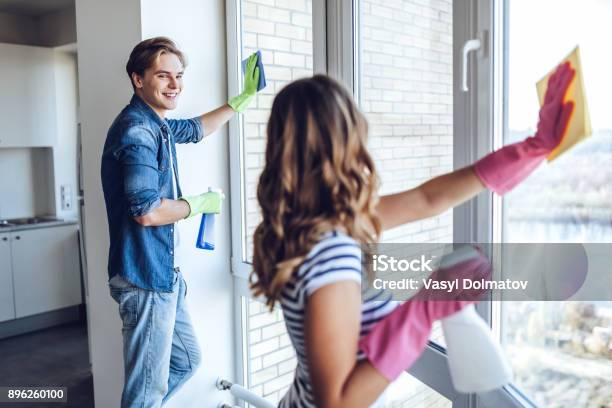 Couple Is Doing Cleaning At Home Stock Photo - Download Image Now - Cleaning, Window, Cleaner