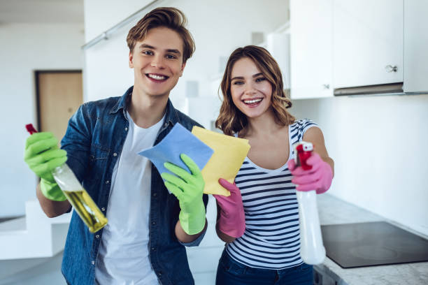 istock Couple is doing cleaning at home. 896260160