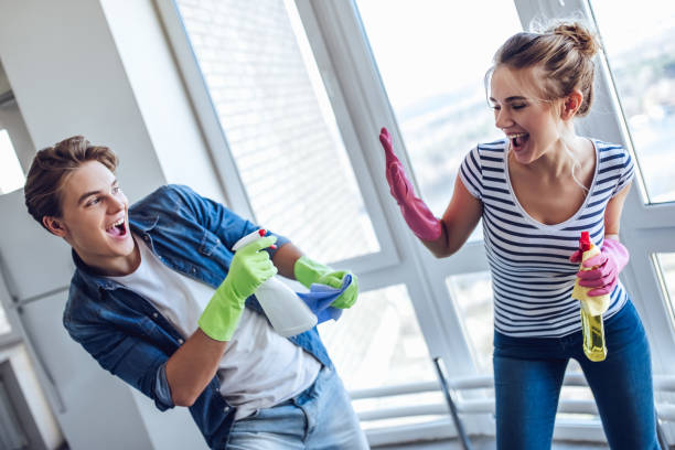 istock Couple is doing cleaning at home. 896260282