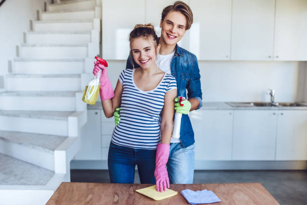 istock Couple is doing cleaning at home. 896260366