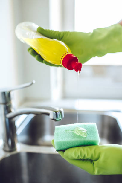 istock Young man is doing cleaning at home. 896260610