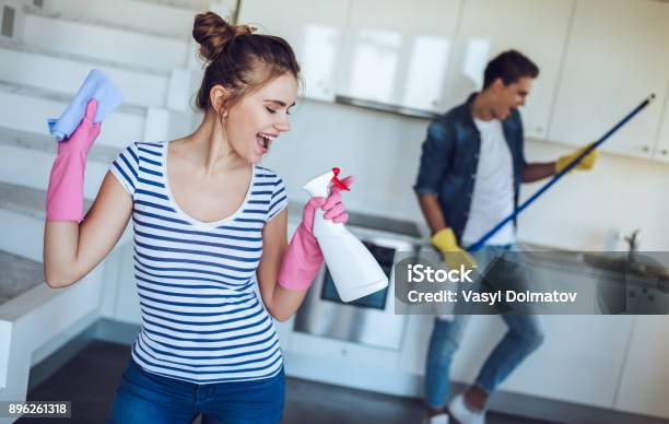 Couple Is Doing Cleaning At Home Stock Photo - Download Image Now - Cleaning, House, Happiness