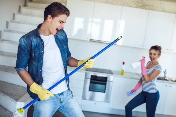 istock Couple is doing cleaning at home. 896261350
