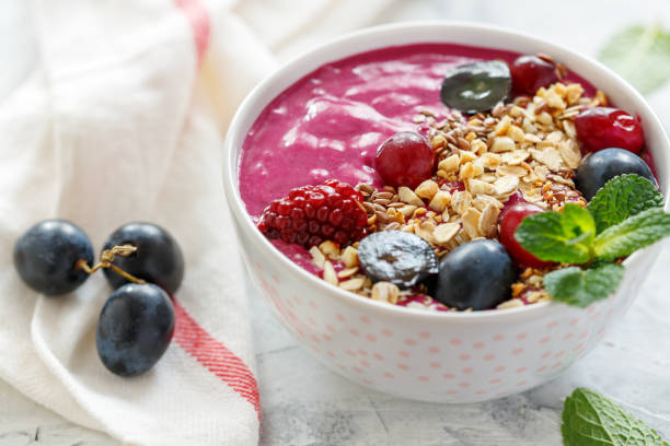 istock Healthy smoothie bowl with red beets and black grapes. 896264208