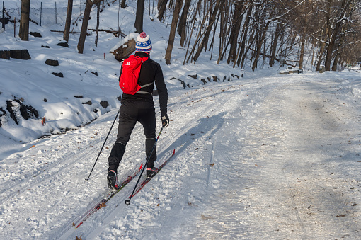 Montreal, CA - 17 December 2017. Cross country skier in the Mont Royal Park in winter.