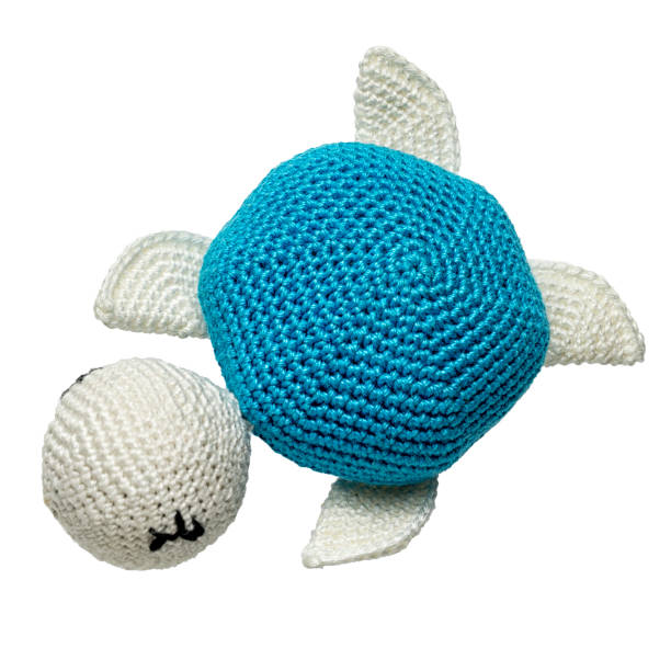 amigurumi crocheted turtle toy isolated on white background