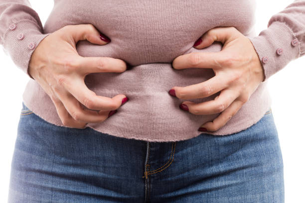 istock Woman grabbing her belly as painful abdominal problem 896277866
