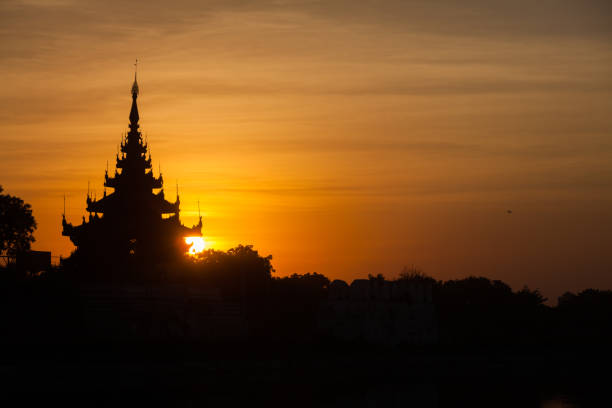 group of ancient pagodas in Bagan at the sun set, myanmar