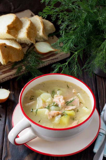 istock Finnish fish soup with salmon on a kitchen wooden kitchen table. 896282988