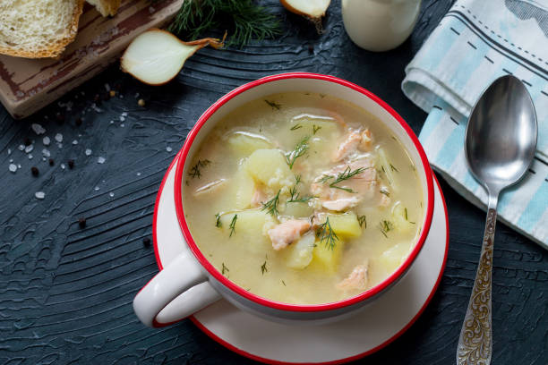 istock Finnish fish soup with red fish with spices and fresh dill on a dark stone background. 896282994