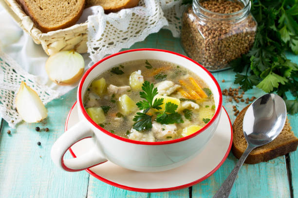 istock Homemade soup with buckwheat and pasta (dumplings) on the kitchen table. 896283298