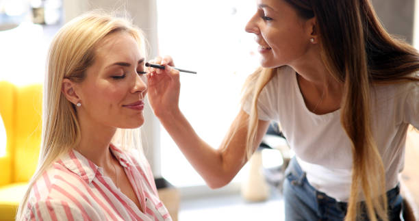 istock Makeup artist applies eye shadow. Perfect makeup 896283322
